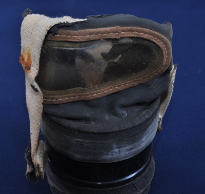 Lot 217 - A WW II child's respirator housed in a...
