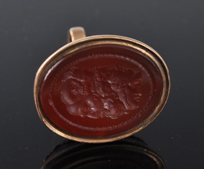 Lot 1137 - An early 19th century yellow metal fob seal,...