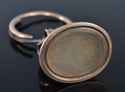Lot 1137 - An early 19th century yellow metal fob seal,...