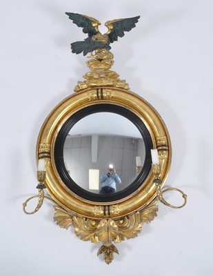 Lot 1430 - A late Regency giltwood and gesso convex wall...