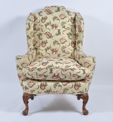 Lot 1434 - A walnut framed wing armchair in the 18th...