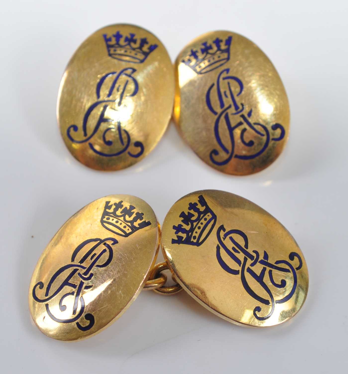 Lot 1209 - A pair of gilt metal double-ended cufflinks,...
