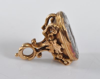Lot 1211 - An early 19th Century yellow metal fob seal,...