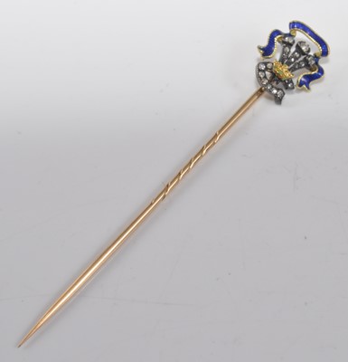 Lot 1203 - A yellow and white metal, enamel and diamond...