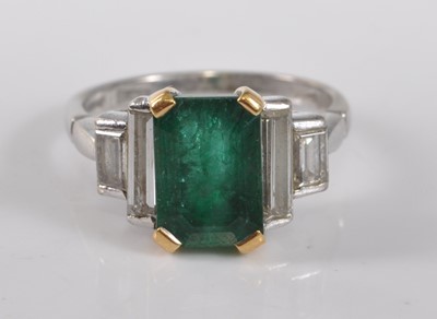 Lot 1159 - An 18ct white gold, emerald and diamond five...