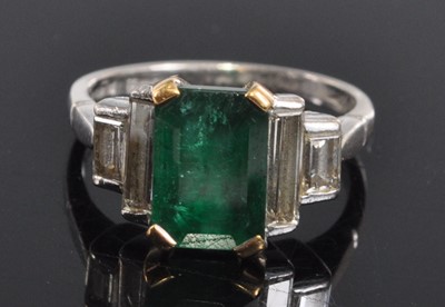 Lot 1159 - An 18ct white gold, emerald and diamond five...