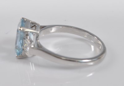 Lot 1180 - A white metal, aquamarine and diamond three...
