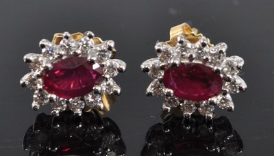 Lot 1165 - A pair of 18ct yellow and white gold, ruby and...