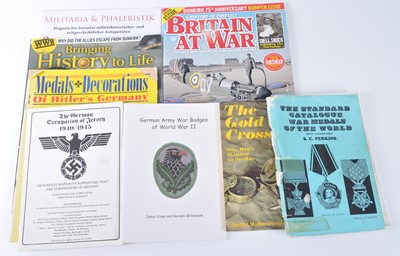 Lot 55 - A collection of military related literature to...