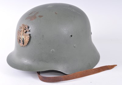Lot 199 - A Spanish Civil War M1926 steel helmet with...