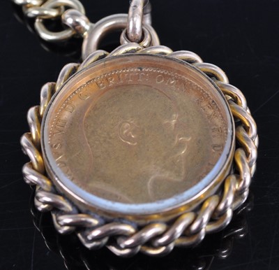 Lot 1224 - An 18ct gold curblink watch chain with Albert...