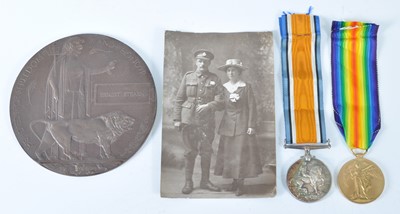 Lot 140 - A WW I Casualty group, to include bronze...