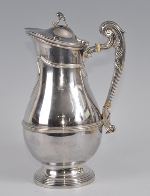 Lot 1099 - An Edwardian silver hot milk pot, of banded...