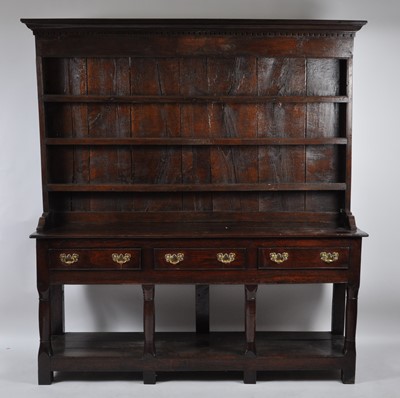 Lot 1446 - A George III joined oak dresser, having...