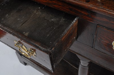 Lot 1446 - A George III joined oak dresser, having...