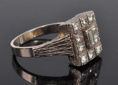 Lot 1188 - A white metal diamond rectangular cluster ring,...