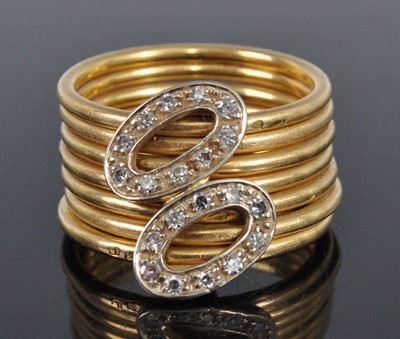 Lot 1190 - A yellow metal seven strand diamond dress ring,...
