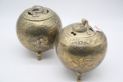 Lot 42 - A pair of eastern brass pot pourri, each of...
