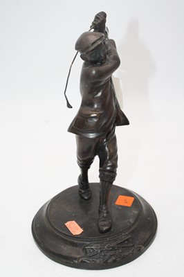 Lot 48 - A reproduction bronzed figure of a golfer in...