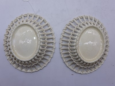 Lot 61 - A pair of Victorian Wedgwood creamware baskets...