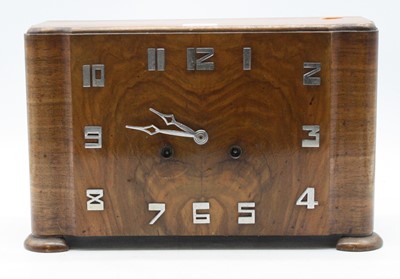 Lot 72 - An Art Deco walnut cased mantel clock of...