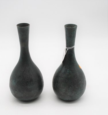 Lot 110 - A pair of bronze alloy vases, each having a...