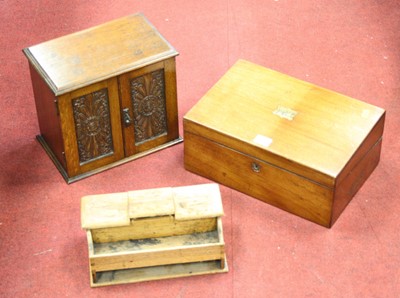 Lot 156 - An Edwardian oak smokers cabinet, enclosed by...