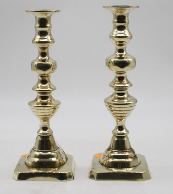 Lot 287 - A pair of Victorian brass candlesticks, each...