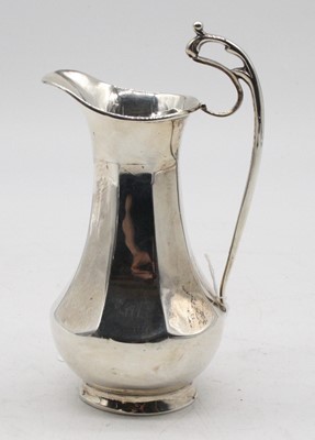 Lot 297 - A George V silver jug, of octagonal baluster...