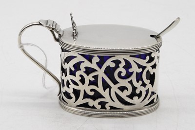 Lot 340 - An Edwardian silver mustard, of pierced oval...