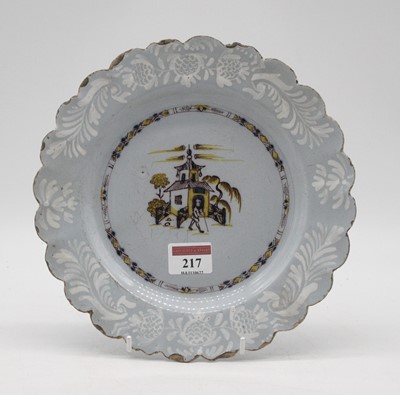 Lot 217 - An 18th century Delft plate on a blue ground,...