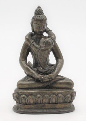 Lot 341 - A small bronzed metal Guan Yin in seated lotus...