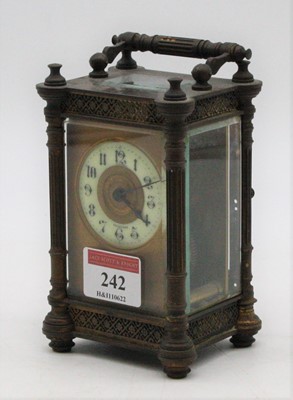 Lot 242 - A brass cased carriage clock having an enamel...