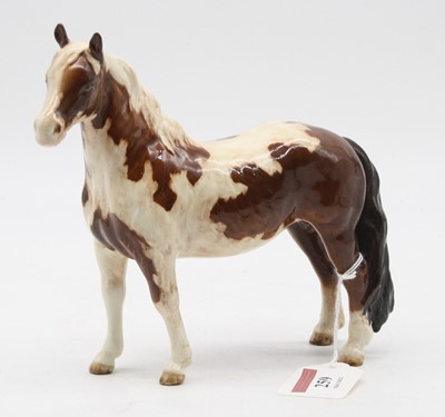 Lot 259 - A Beswick figure of a skewbald pinto pony...