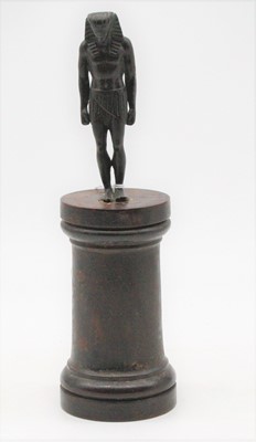 Lot 265 - A small bronzed figure of an Egyptian male in...