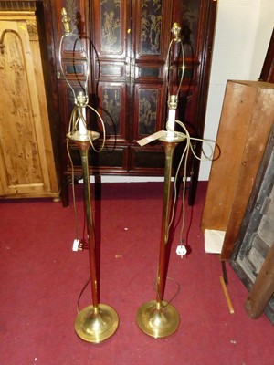 Lot 1153 - A pair of contemporary polished brass standard...