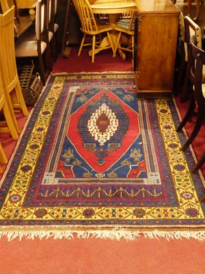 Lot 1179 - A Persian woollen blue ground Shiraz rug, the...