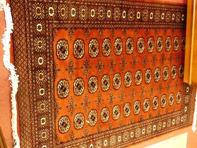 Lot 1183 - A Persian style machine woven red ground...