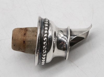 Lot 356 - A modern silver wine bottle spout, having a...