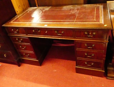 Lot 1218 - A reproduction mahogany and gilt tooled...