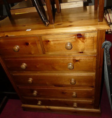 Lot 1255 - A modern pine squarefront chest, of two short...