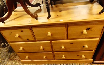 Lot 1258 - A contemporary pine side chest, fitted with...