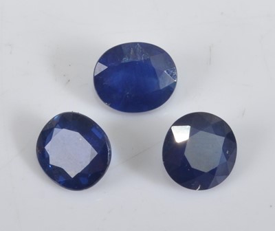 Lot 411 - Three loose blue sapphires, being one round...