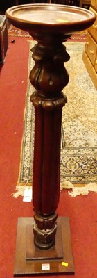 Lot 1259 - A carved mahogany plant stand, h.94.5cm