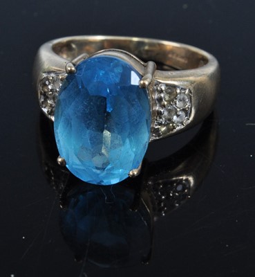 Lot 422 - A modern 9ct gold blue topaz and white stone...