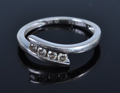 Lot 446 - A 9ct white gold diamond dress ring, total...