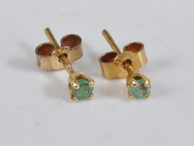 Lot 455 - A pair of 9ct gold and emerald set ear studs,...