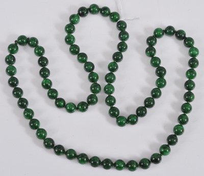 Lot 474 - A beaded and knotted faux malachite single...