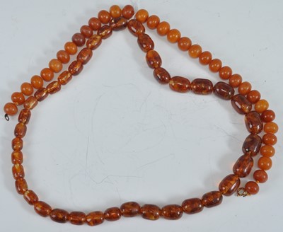 Lot 475 - A beaded faux butterscotch amber single string...