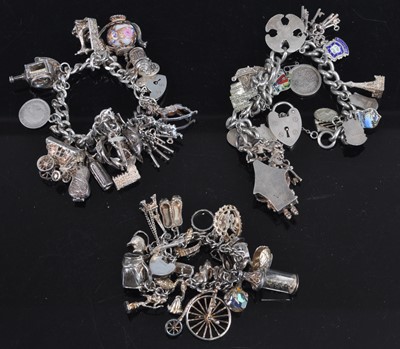 Lot 476 - A silver curb link bracelet containing a large...